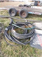 Rolls of black plastic pipe, other hoses