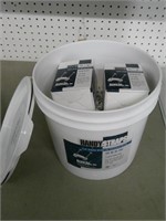 partial bucket of wire staples