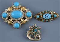 (3) Vintage brooches to include: Gold plated with