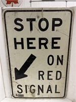 Road sign- Stop Here on Red Signal