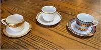 3 small teacups and saucers