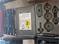 brake caliper tool kit and a box of extension