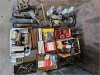 pallet of brake shoes, grease guns, rubber