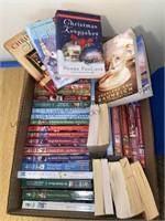 Box of Christmas themed romance books and more