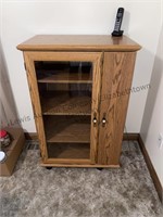 Glass front storage cabinet approximate