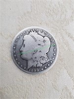 1899 Morgan silver dollar.