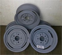 A set of 5 15" 5 bolt steel rims with primer