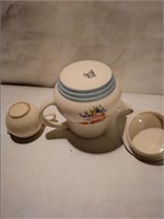 Ceramic tea pot and cup