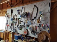 Garden Items, Paint Brushes And Items On Pegboard