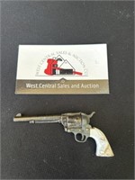 Miniature toy Colt 45 revolver