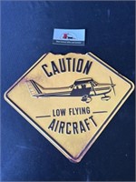 Caution low flying aircraft sign