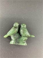 Pair of lovebirds on a pedestal all carved out of