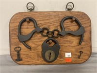 Set of Handcuffs and Lock on Plaque