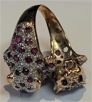 A diamond and rubies panther ring in 14k gold