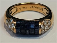 A diamond and blue sapphire ring in 18k gold
