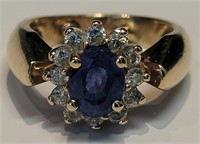 A blue sapphire and diamond ring in 14k gold