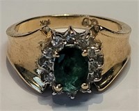 A green tourmaline and diamond ring in 14k gold