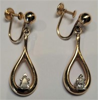 Pair of diamond earrings in 14k YL and WT gold
