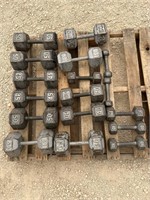 Open pallet of assorted metal dumbbells
