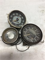 Two speedometers and one gauge cluster