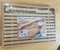 Bread board with knife.