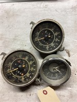 Two speedometers and one clock