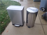 Two stainless steel kitchen trash cans.