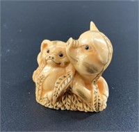 Antique mammoth netsuke of a mother pig and piglet