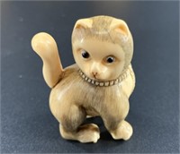 Antique mammoth netsuke of cat standing tall and t