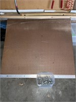 4 x 4 pegboard with pegs and miscellaneous lumber