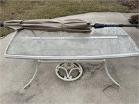 Glass 40” x 60” glass table with umbrella and