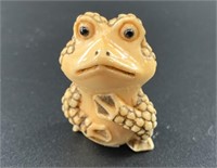 Antique mammoth netsuke of a very expressive toad,