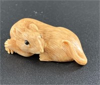 Antique mammoth netsuke of a small rat curled up,