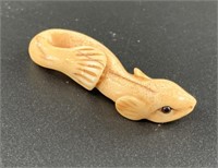 Antique mammoth netsuke of what appears to be a ca