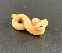Antique mammoth netsuke of a small snake curled up