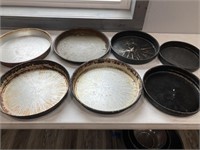 7 deep dish pizza pans, various sizes