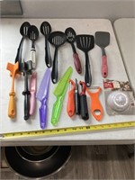 Assorted plastic slotted spoons, spatulas,