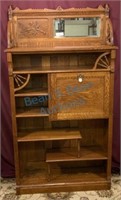 Oak bookcase with drop front desk and beveled