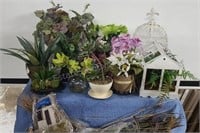 Assorted artificial flowers and plants. Some with