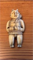 Carved ivory Netsuke man figure , with a hole