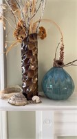 Blue ceramic vase with a birds nest, and a carved