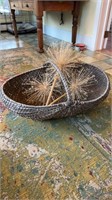 Large woven basket with a woven wrapped handle,