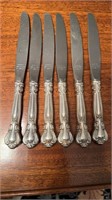6 sterling silver dinner knives ,  in the