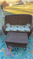 Outdoor newer, wicker, settee sofa with a