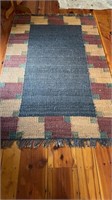 Neutral color braided rug carpet, a jute