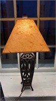 Iron metal table lamp with a brown paper shade,