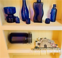 Two shelves, 8 pieces of cobalt blue glass, and a