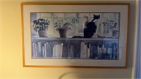 Large framed print with two cats looking out the