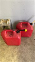 Two 5 gallon, red plastic, gas cans, currently