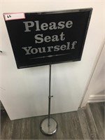 1X REVERSIBLE SEATED SIGN
